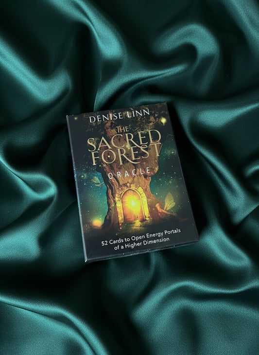 Box of 'The Sacred Forest Oracle' cards on a textured surface