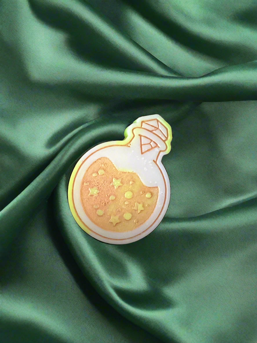 Moon Water wax melt on a dark green satin fabric
